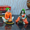 Ecraftindia Rajasthani Craftman and Lady Polyresin Statue | Orange, Green and Brown