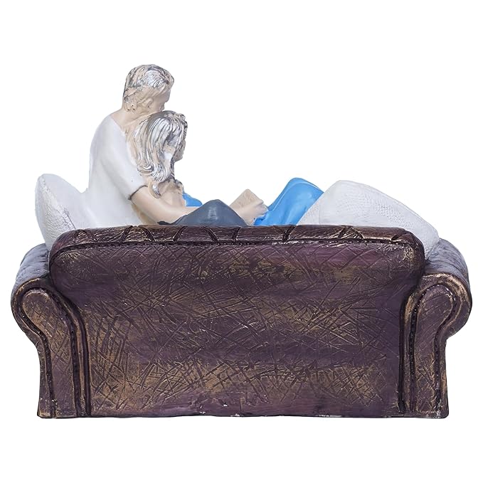 Ecraftindia Romantic Couple Statue Sitting on Sofa and Reading Book Decorative Showpiece
