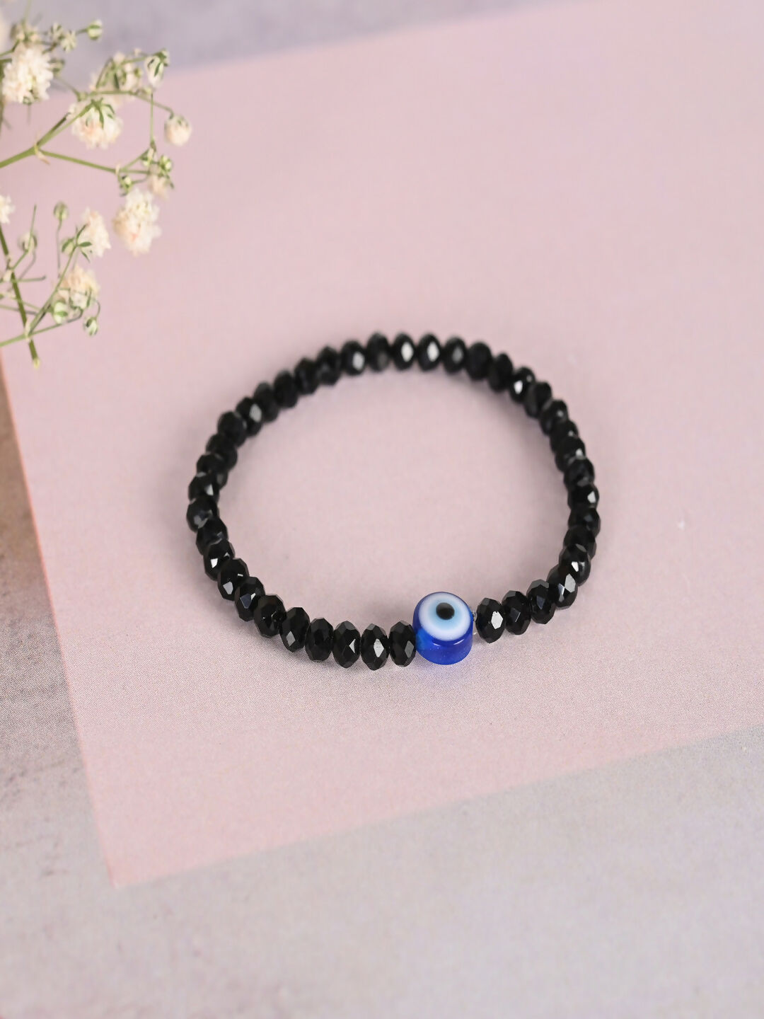 NVR Women & Men Black Evil Eye Elasticated Rakhi With Roli Chawal