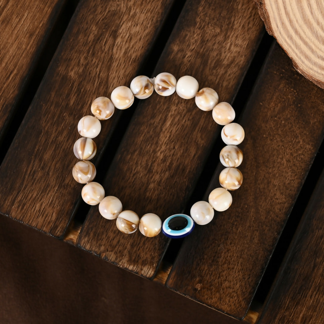 NVR Women & Men Cream-colored Evil Eye Elasticated Rakhi With Roli Chawal