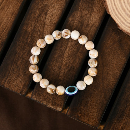 NVR Women & Men Cream-colored Evil Eye Elasticated Rakhi With Roli Chawal