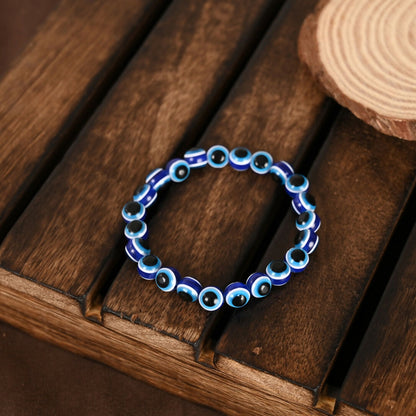 NVR Women & Men Blue Evil Eye Rakhi With Roli Chawal