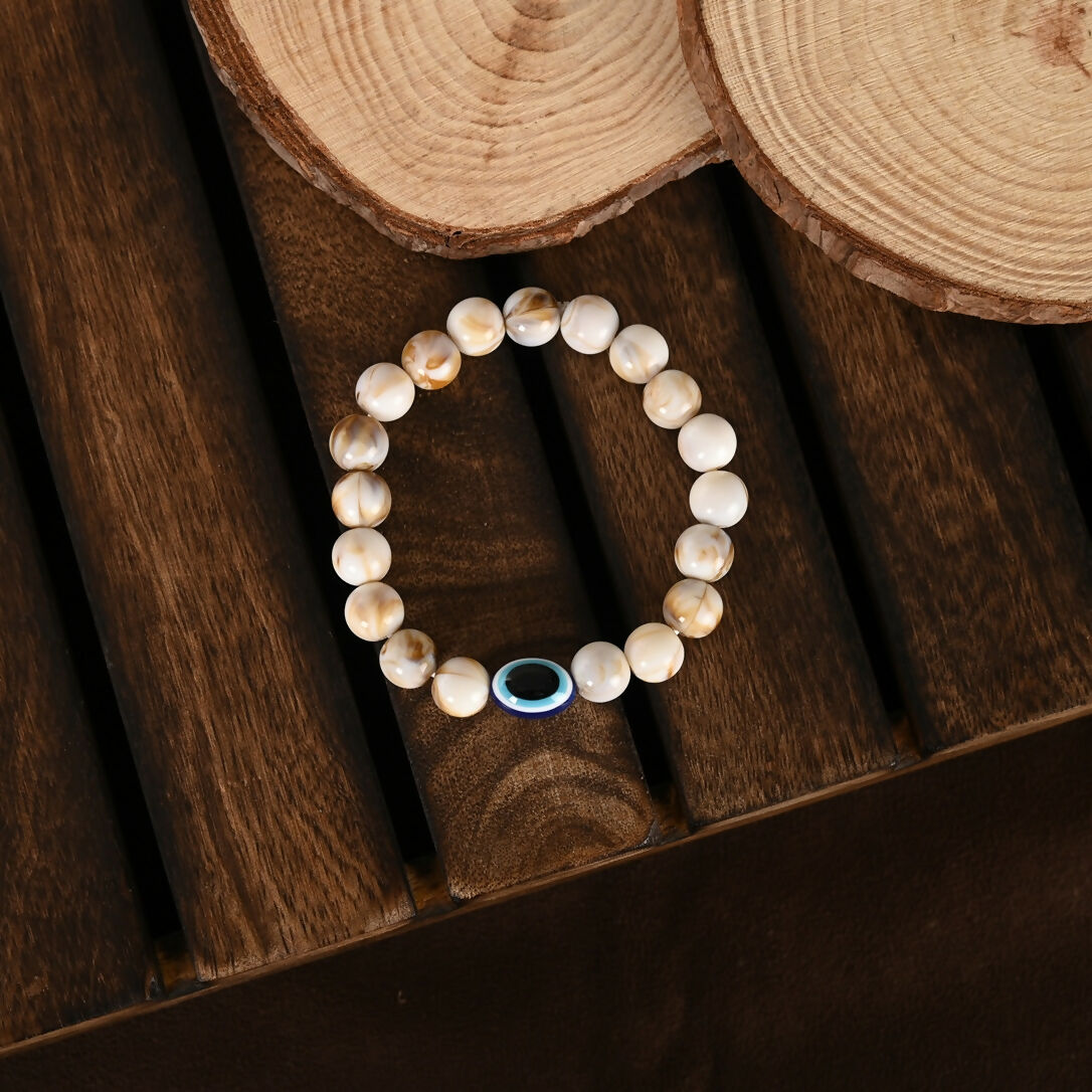 NVR Women & Men Cream-colored Evil Eye Elasticated Rakhi With Roli Chawal