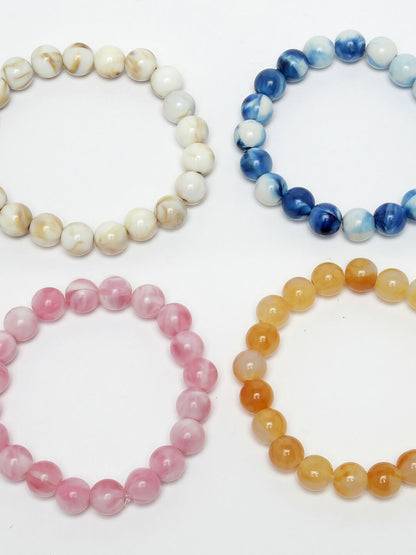 NVR Women & Men Set of 4 Multicolor Elasticated Rakhi With Roli Chawal