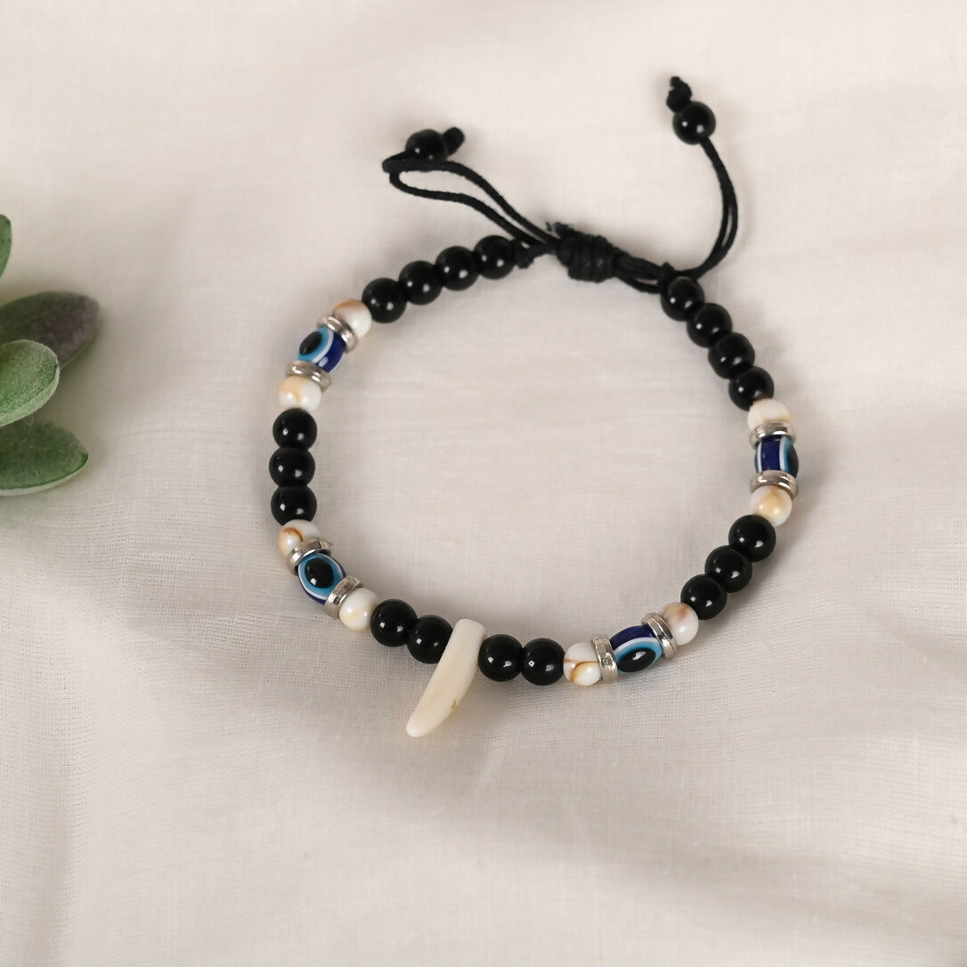 NVR Women & Men Black Evil Eye Rakhi With Roli Chawal