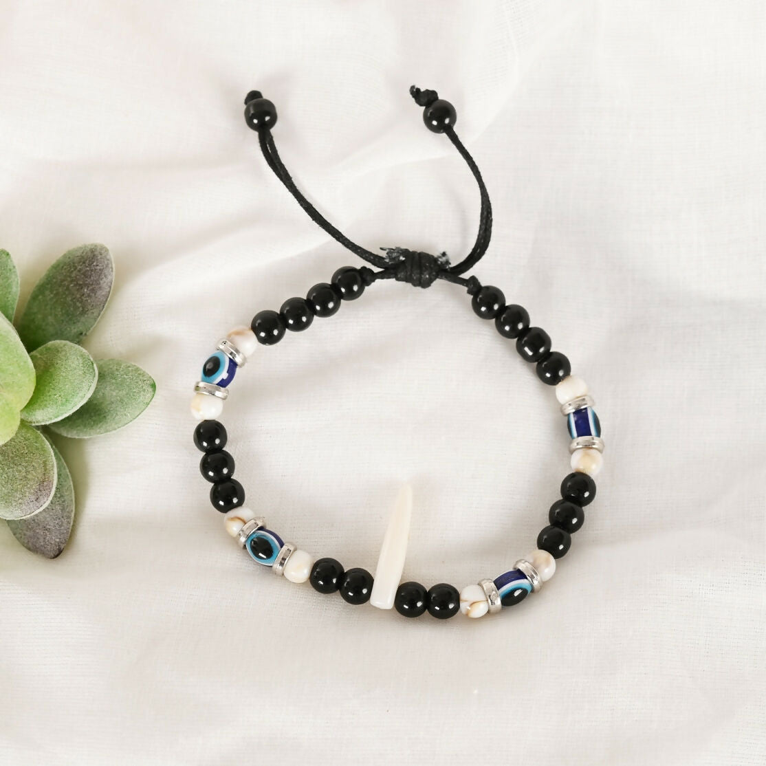 NVR Women & Men Black Evil Eye Rakhi With Roli Chawal