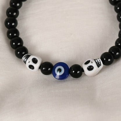 NVR Women & Men Black Evil Eye Rakhi With Roli Chawal