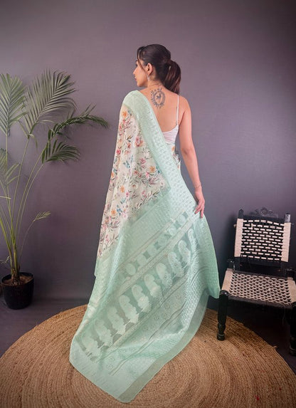 Elora Cyan Blue Silk Floral Motifs Coppery Tone Contrast Floral Border Banarasi Saree