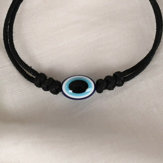NVR Women & Men Black Evil Eye Rakhi With Roli Chawal