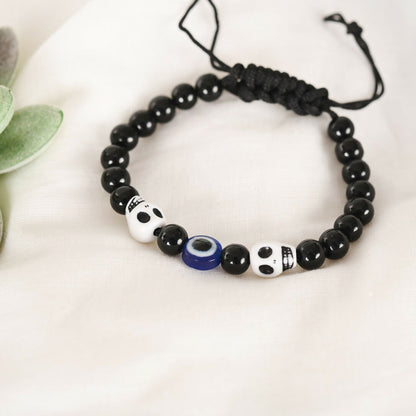 NVR Women & Men Black Evil Eye Rakhi With Roli Chawal