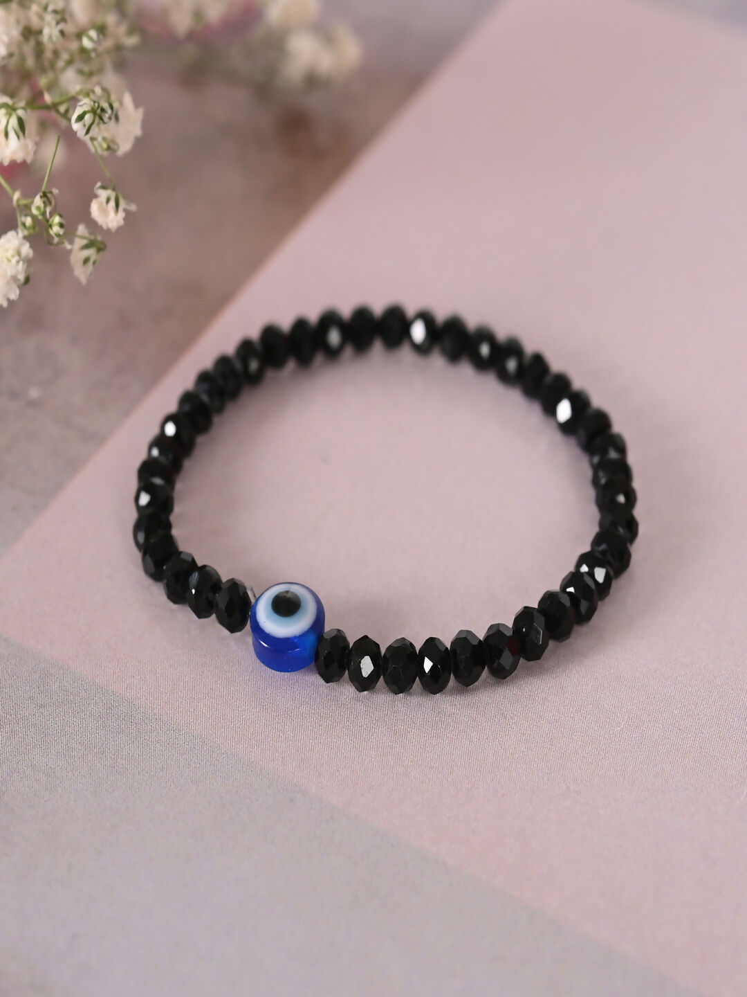 NVR Women & Men Black Evil Eye Elasticated Rakhi With Roli Chawal