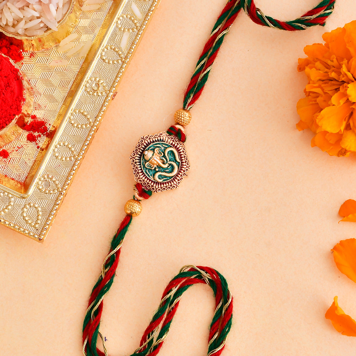 trueBrowns X Voylla Traditional Om And Lord Ganesha Motif Thread Rakhi