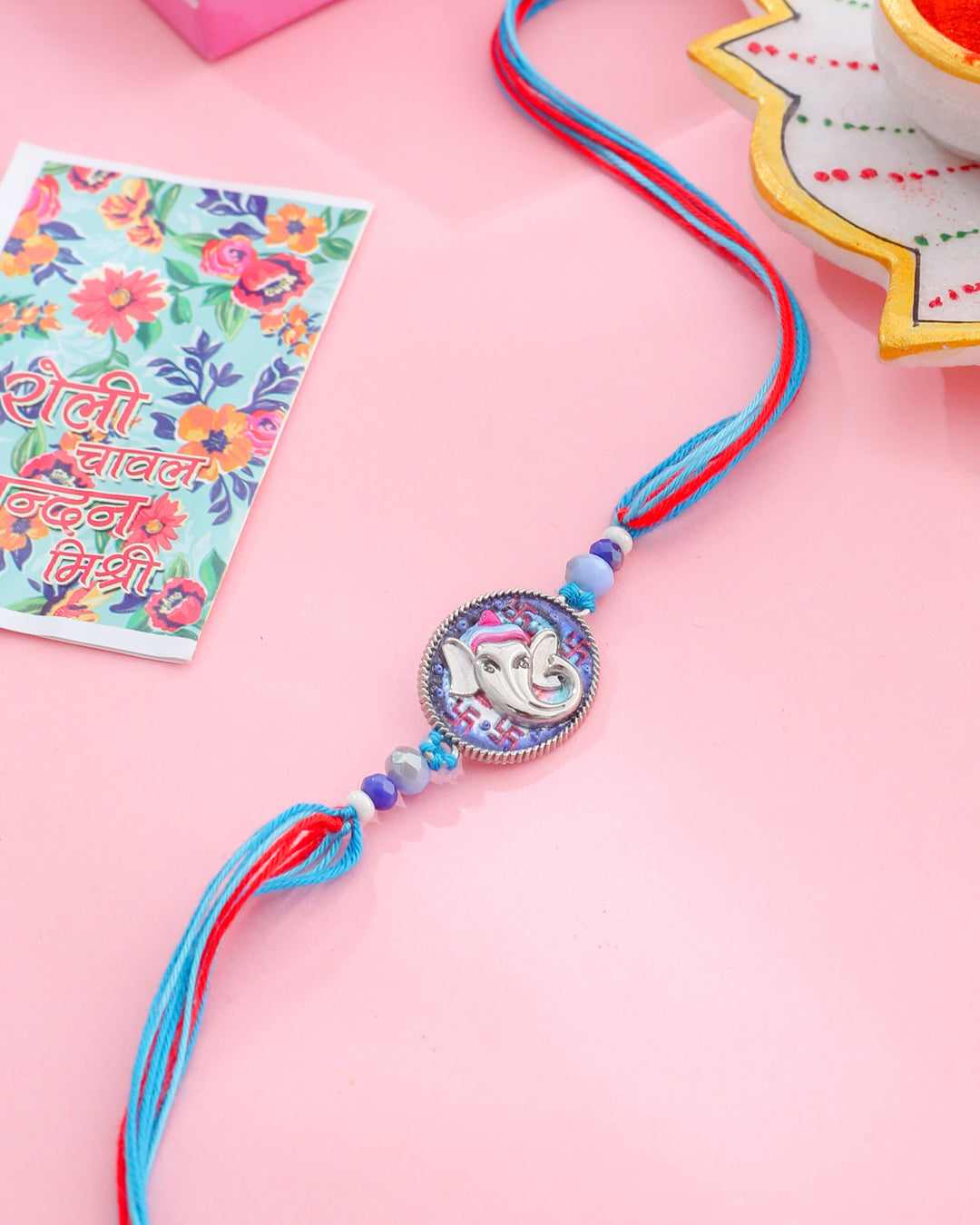 NVR Men Red & Blue Ganesh Ji Thread Rakhi with Roli Chawal Chandan & Mishri