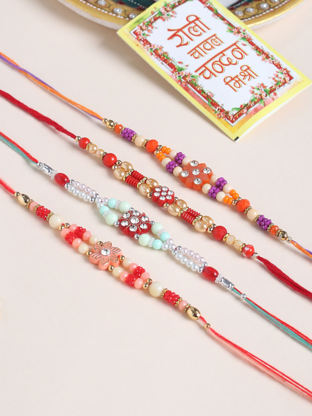 NVR Men Set of 4 Floral Design Multicolor Artificial Stones and Beads Thread Rakhi with Roli Chawal Chandan & Mishri