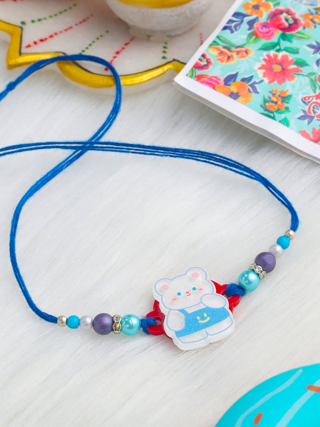 NVR Kids Teddy Blue Artificial Beads Thread Rakhi with Roli Chawal Chandan & Mishri