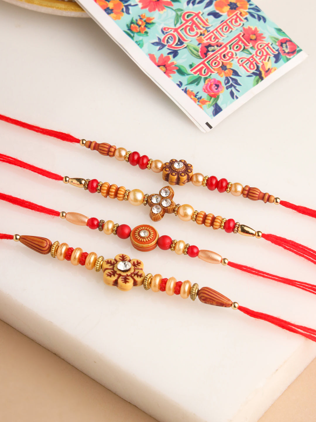 NVR Men Set of 4 Red Artificial Stones & Beads Floral Shape Thread Rakhi with Roli Chawal Chandan & Mishri