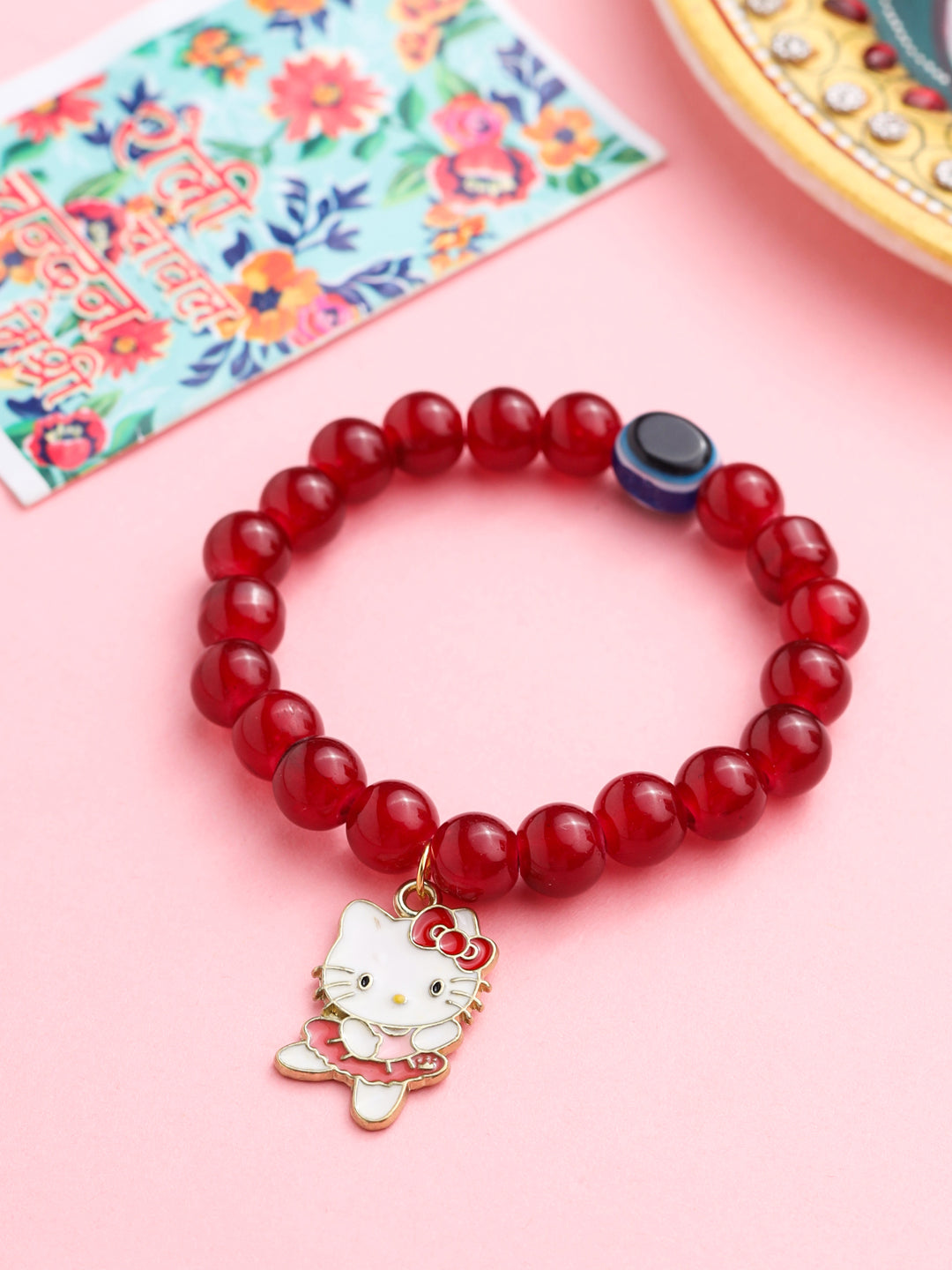 NVR Kids Cartoon Design Maroon Artificial Beads Thread Rakhi with Roli Chawal Chandan & Mishri