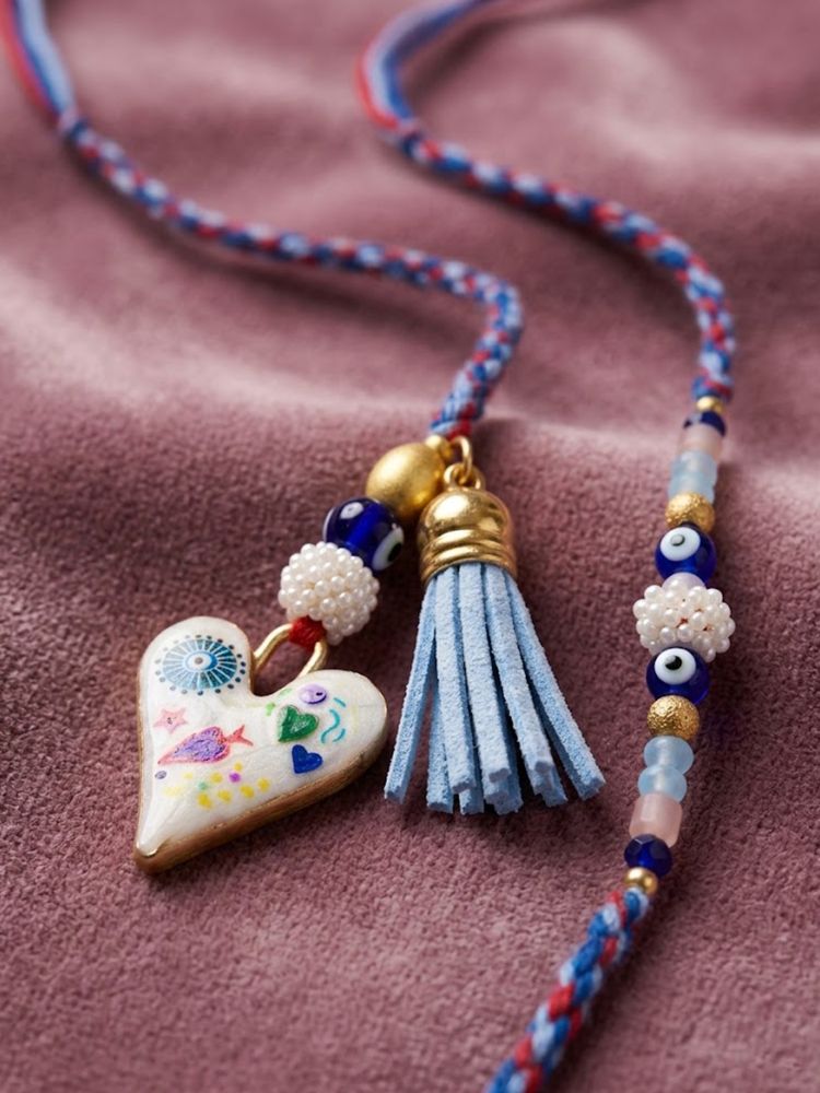 NVR Set of 2 Evil Eye Beaded Heart Shape Bhaiya Bhabhi Rakhi with Roli Chawal Chandan