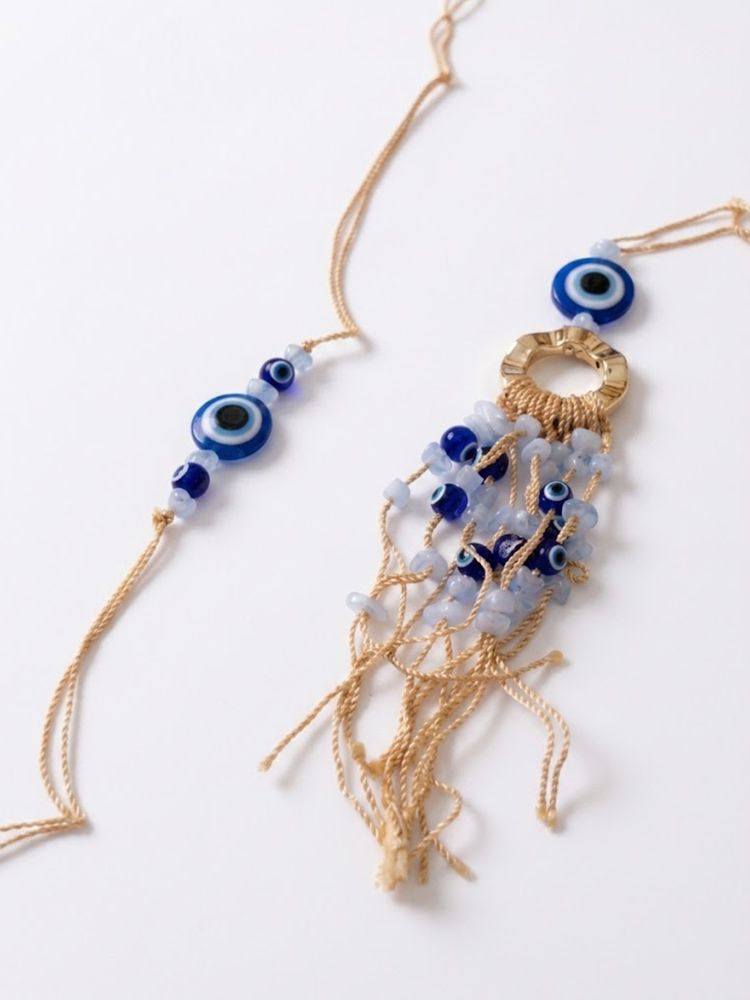 NVR Set of 2 Gold Toned Round Evil Eye Bhaiya Bhabhi Rakhi with Roli Chawal Chandan Mishri