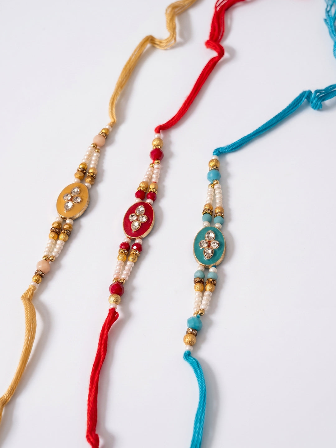 NVR Set of 3 Multicolor Artificial Beads & White Pearls Thread Rakhi with Roli Chawal