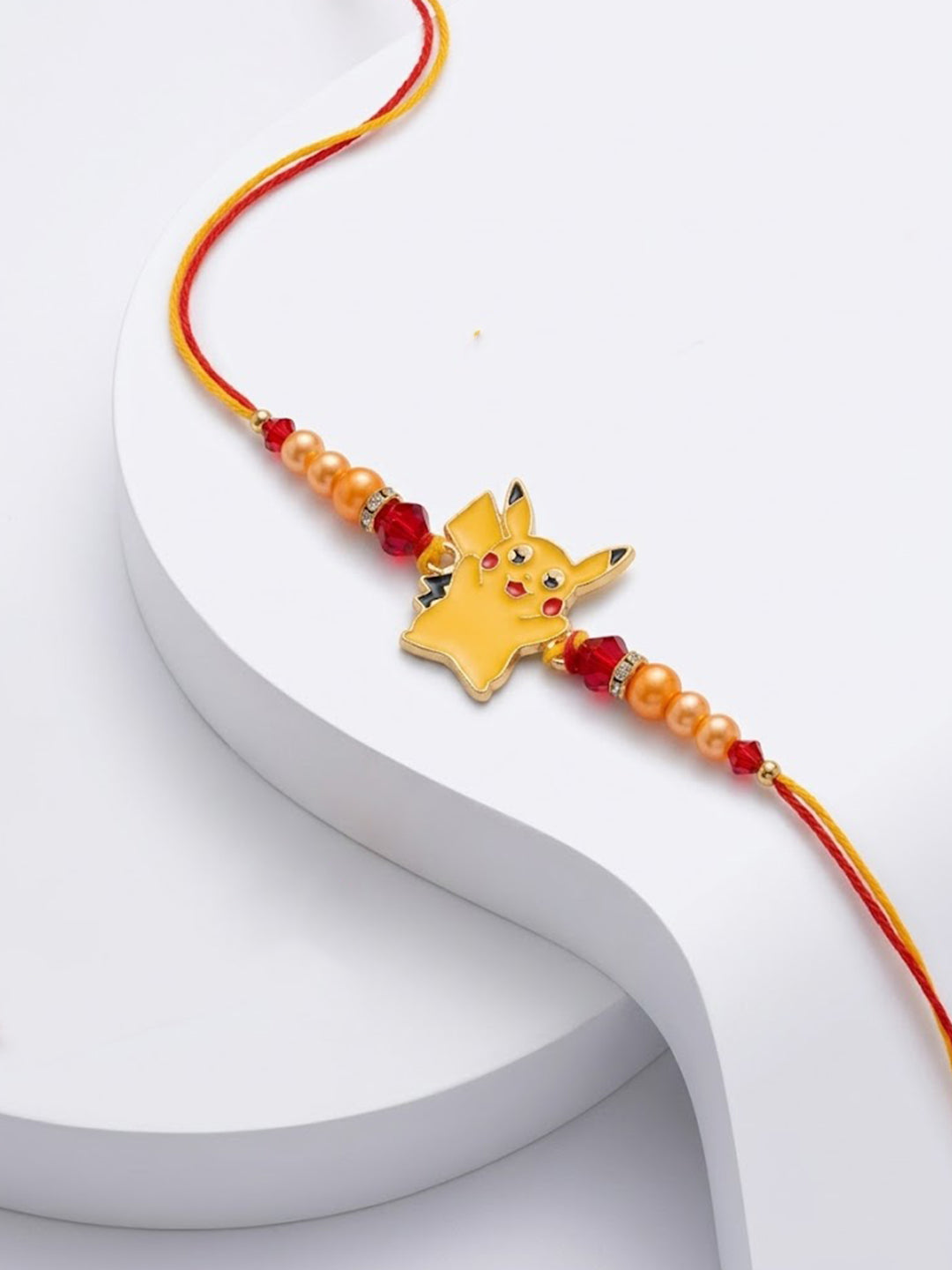 NVR Kids Pikachu Pokemon Cartoon Yellow & Red Thread Rakhi with Roli Chawal Chandan Mishri