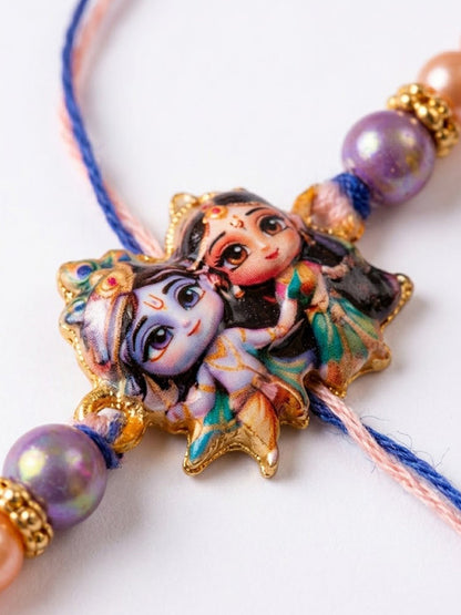 NVR Radha Krishna Multicolor Artificial Beads Thread Rakhi With Roli Chawal Chandan Mishri