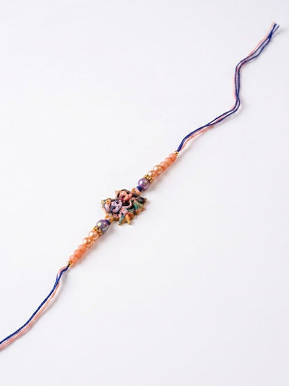 NVR Radha Krishna Multicolor Artificial Beads Thread Rakhi With Roli Chawal Chandan Mishri