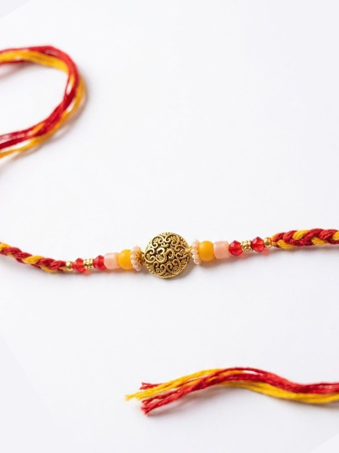NVR Artificial Beads Decorative Om Design Religious Thread Rakhi with Roli Chawal Chandan