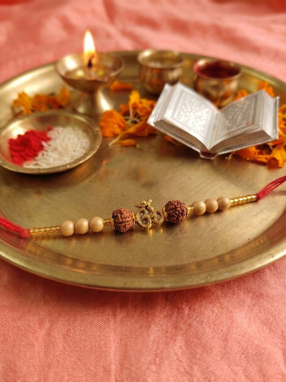 NVR Om Design Rudraksh Thread Rakhi with Roli Chawal Chandan Mishri