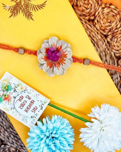 NVR Multicolor Floral Design Plant Seed Rakhi with Roli Chawal Chandan Mishri