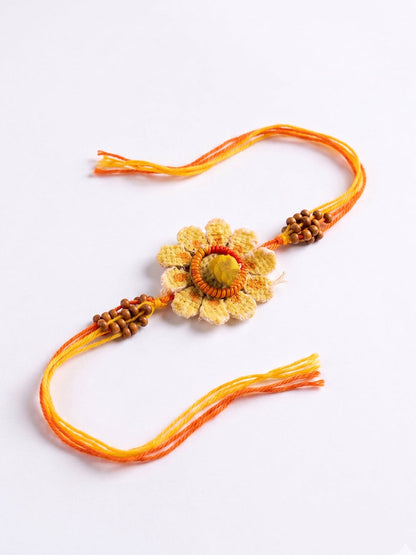 NVR Yellow Floral Seed Thread Rakhi with Roli Chawal Chandan Mishri
