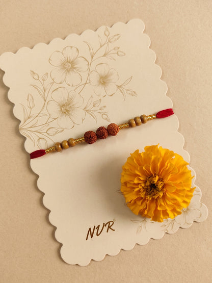 NVR Religious Rudraksh & Red Thread Rakhi with Roli Chawal Chandan Mishri