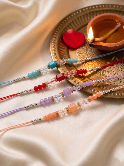 NVR Set of 4 Multicolor Artificial Beads Thread Rakhi with Roli Chawal Chandan Mishri