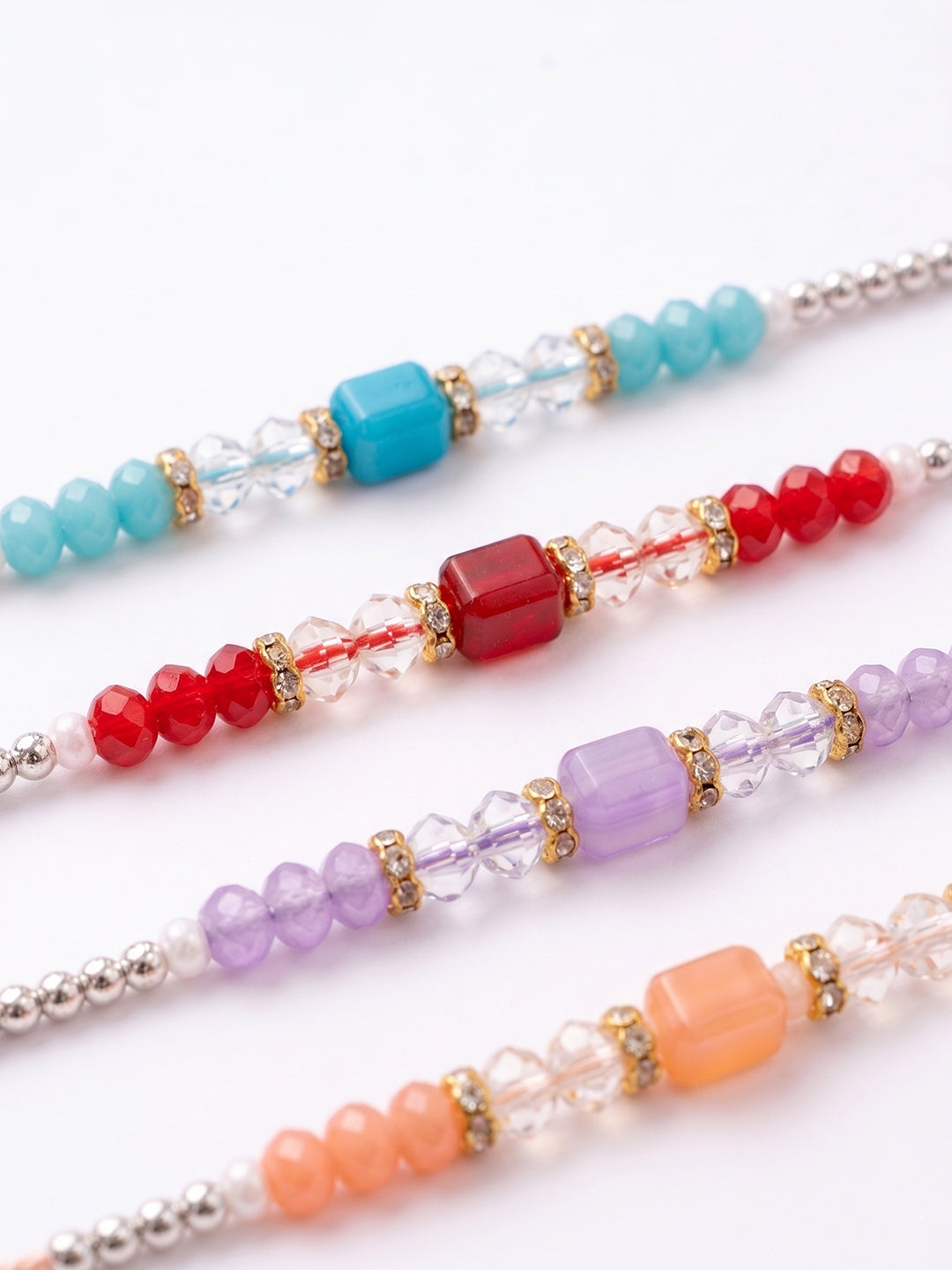 NVR Set of 4 Multicolor Artificial Beads Thread Rakhi with Roli Chawal Chandan Mishri