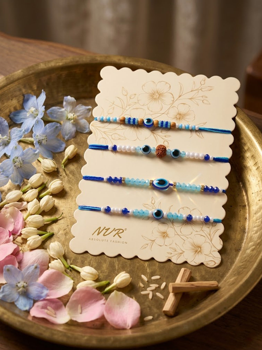 NVR Set of 4 Blue Evil Eye Thread Rakhi with Roli Chawal Chandan Mishri