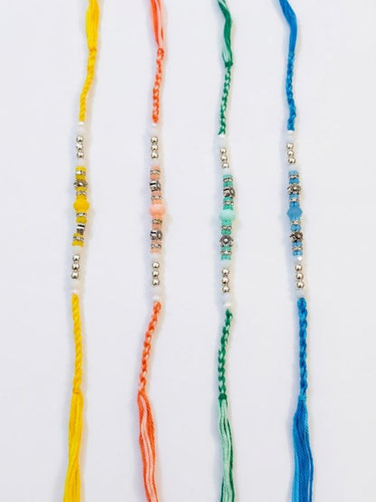 NVR Set of 4 Multicolor Artificial Beads Thread Rakhi with Roli Chawal Chandan Mishri