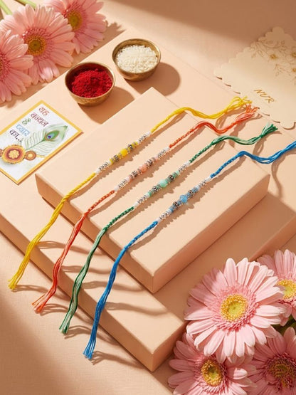 NVR Set of 4 Multicolor Artificial Beads Thread Rakhi with Roli Chawal Chandan Mishri