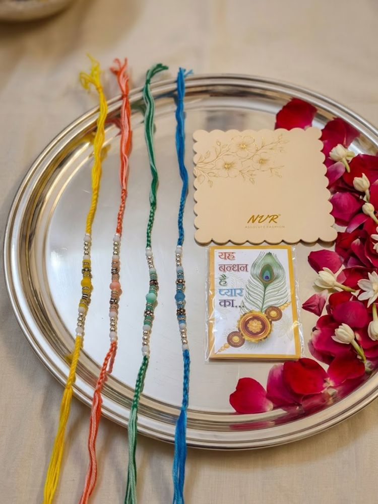 NVR Set of 4 Multicolor Artificial Beads Thread Rakhi with Roli Chawal Chandan Mishri
