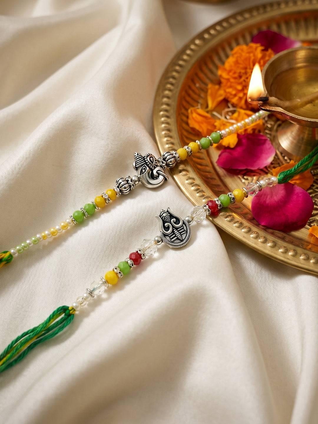NVR Set of 2 Multicolor Religious Thread Rakhi with Roli Chawal Chandan Mishri