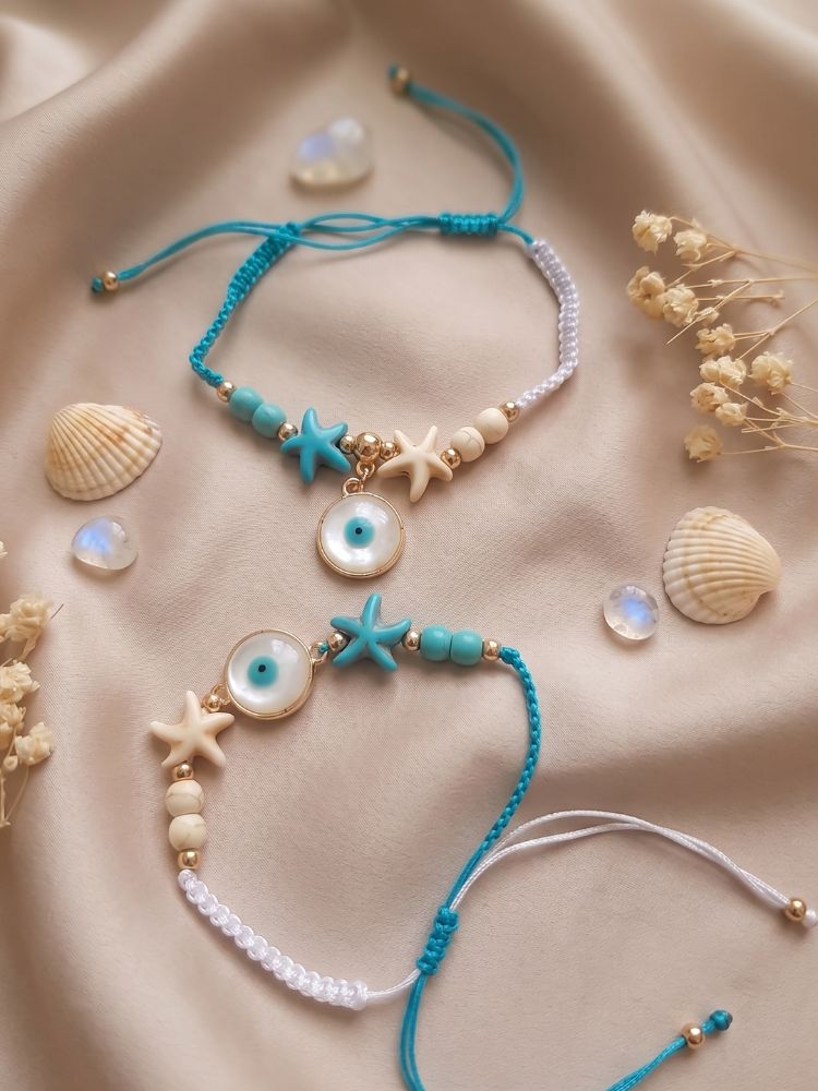 NVR Set of 2 Blue Evil Eye & White Pearl Bhaiya Bhabhi Rakhi with Roli Chawal Chandan