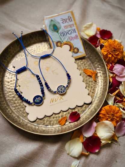 NVR Set of 2 Blue Evil Eye Thread Rakhi With Roli Chawal Chandan Mishri
