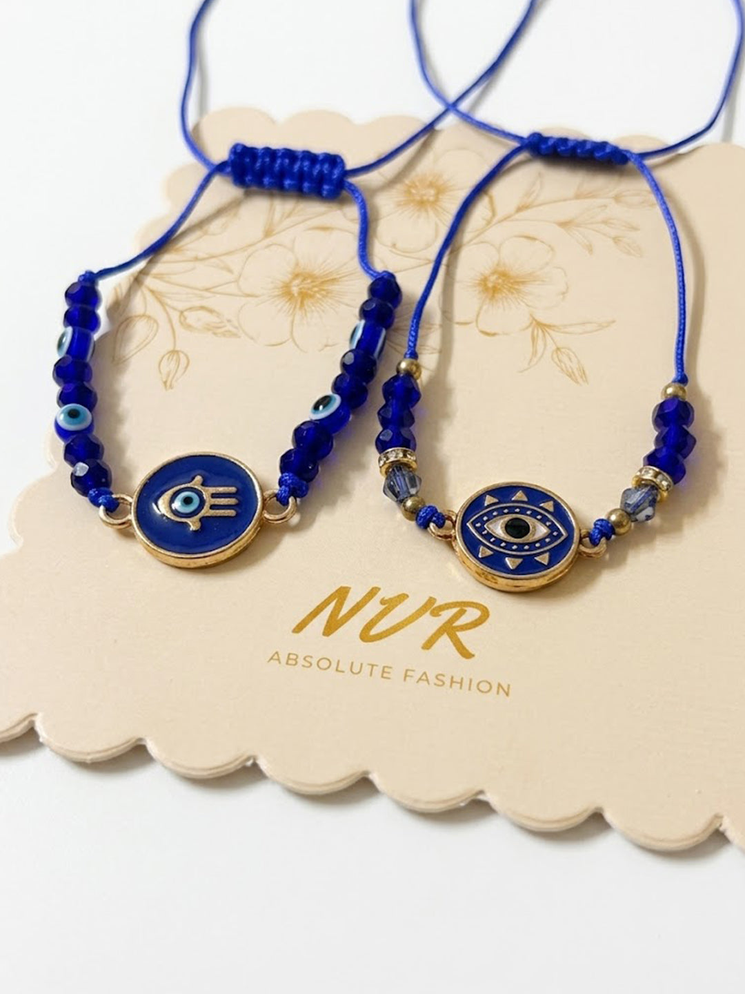 NVR Set of 2 Blue Evil Eye Thread Rakhi With Roli Chawal Chandan Mishri
