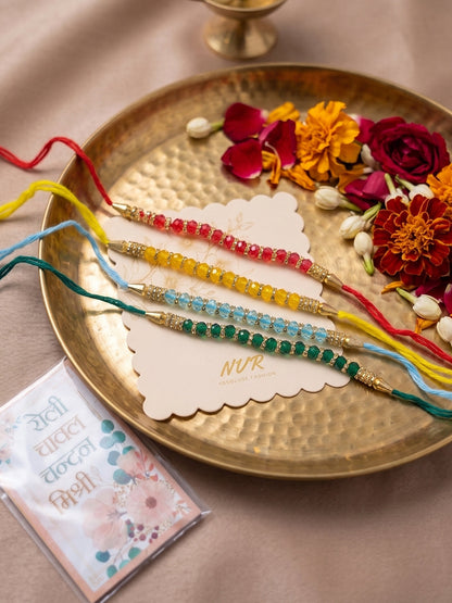 NVR Set of 4 Multicolor Artificial Beads Thread Rakhi with Roli Chawal Chandan Mishri
