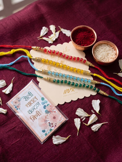 NVR Set of 4 Multicolor Artificial Beads Thread Rakhi with Roli Chawal Chandan Mishri