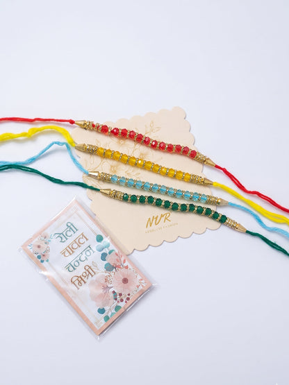 NVR Set of 4 Multicolor Artificial Beads Thread Rakhi with Roli Chawal Chandan Mishri