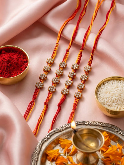 NVR Set of 4 Artificial Stones Floral Design Thread Rakhi with Roli Chawal Chandan Mishri
