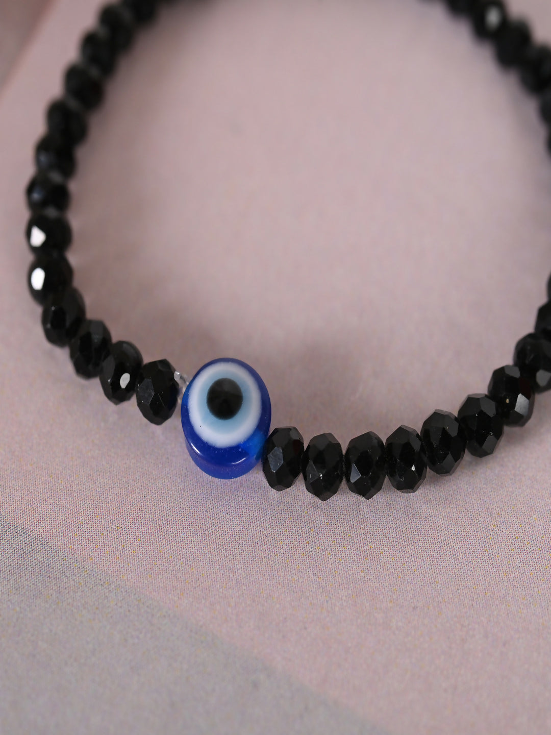 NVR Women & Men Black Evil Eye Elasticated Rakhi With Roli Chawal