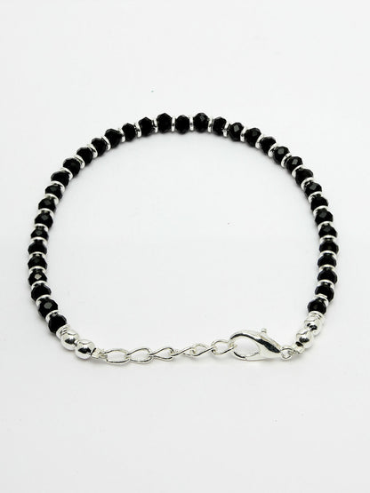 NVR Women Silver Plated Black Beaded Adjustable Rakhi With Roli Chawal