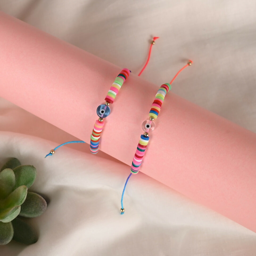 NVR Women & Men Set of 2 Multicolor Evil Eye Rakhi With Roli Chawal