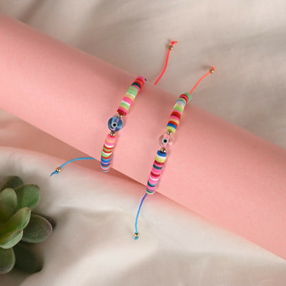 NVR Women & Men Set of 2 Multicolor Evil Eye Rakhi With Roli Chawal